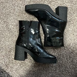 Black faux leather booties.